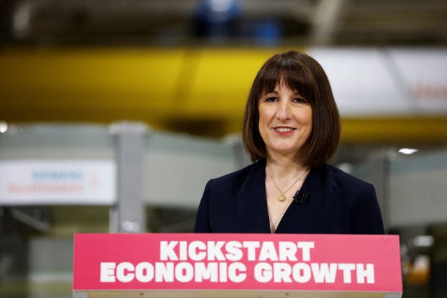 Rachel Reeves smiling at a lectern which reads 'Kickstart economic growth'