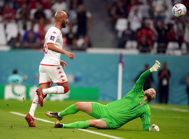 Issam Jebali (left) has a shot saved