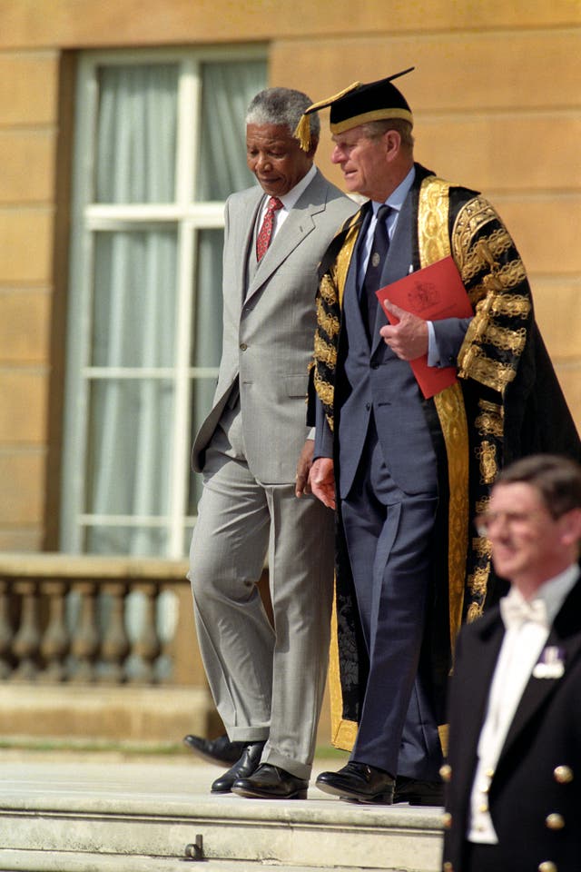 South Africa's then president Nelson Mandela and the Duke of Edinburgh at Buckingham Palace (John Stillwell/PA)