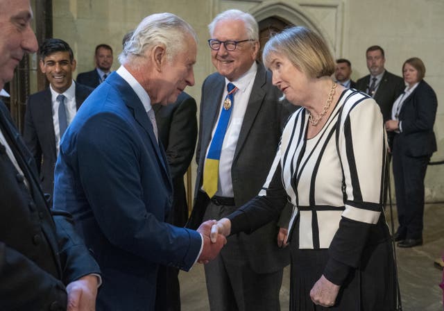 King Charles III speaks with Harriet Harman during his visit to Westminster Hall at the Palace of Westminster to attend a reception ahead of the coronation (Arthur Edwards)