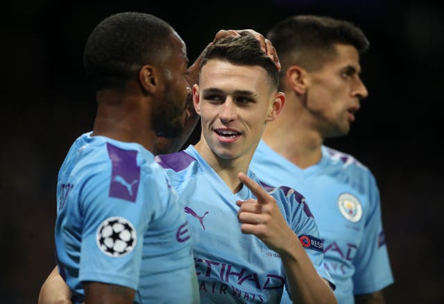 Phil Foden, centre, sealed the victory late on for City