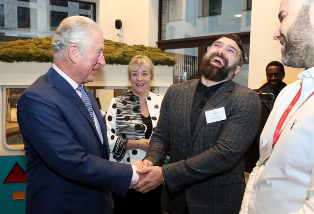 The Prince of Wales shares a joke with Ant Middleton