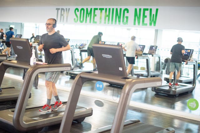 People exercise in the gym at Clissold Leisure Centre, north London
