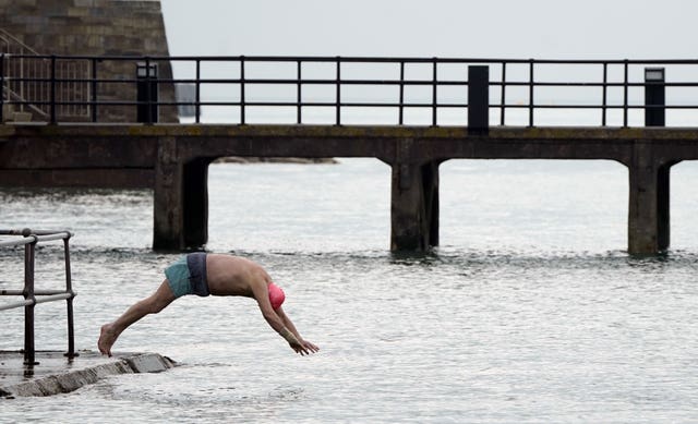 Someone dives into the sea