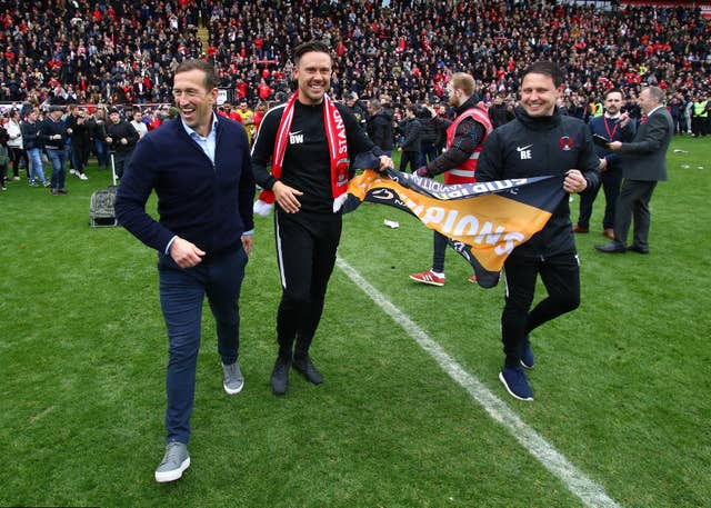 Ross Embleton, right, with Justin Edinburgh, left, and Danny Webb after Leyton Orient secured the Vanarama National League title in April 2019
