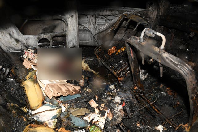 The inside of a burnt out Peugeot 206 on the M61