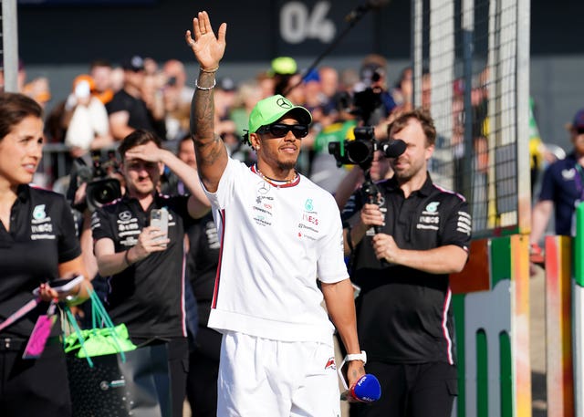 Lewis Hamilton waves to fans on paddock day ahead of the British Grand Prix