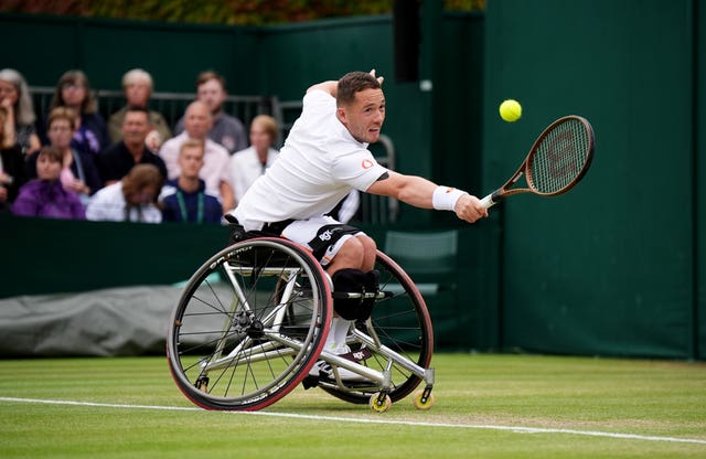Alfie Hewett stretches for a backhand