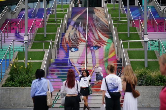 Taylor Swift fans climbing the 'Swiftie steps' at Wembley