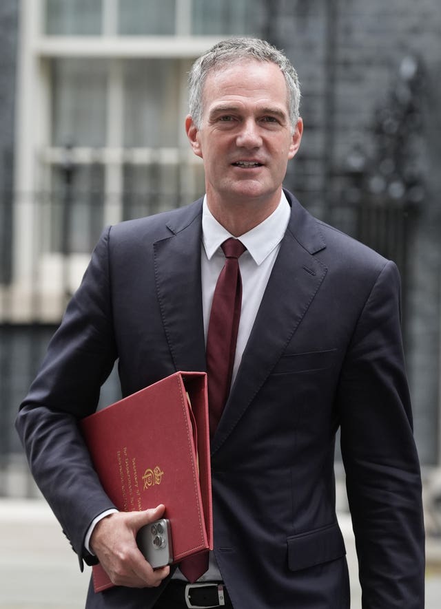  Peter Kyle walking on Downing Street, carrying his red ministerial folder under his arm