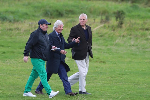 The Duke of York with solicitor Paul Tweed (centre) as he attends The Duke of York Young Champions Trophy at the Royal Portrush Golf Club in County Antrim