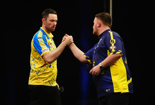 Luke Humphries, left, and Luke Littler shake hands 