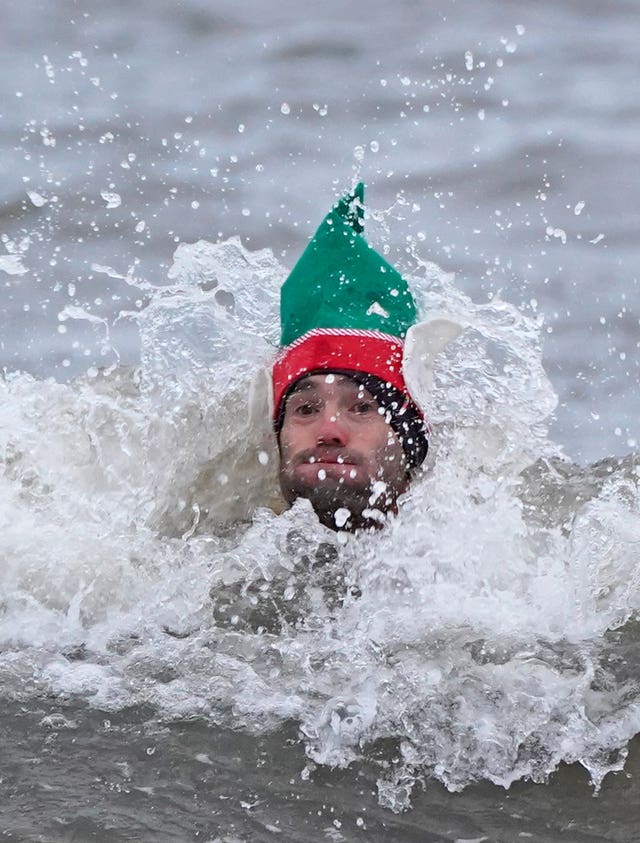 A swimmer takes a Christmas Day dip