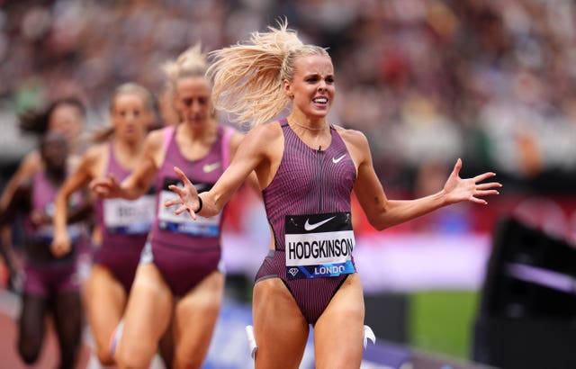London Diamond League 800m winner Keely Hodgkinson grins with open arms as she crosses the finish line at London Stadium