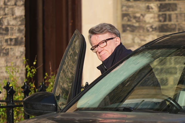 Lord Peter Mandelson getting in a car