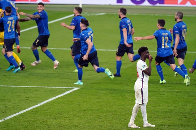 England’s Bukayo Saka stands dejected after missing his penalty against Italy