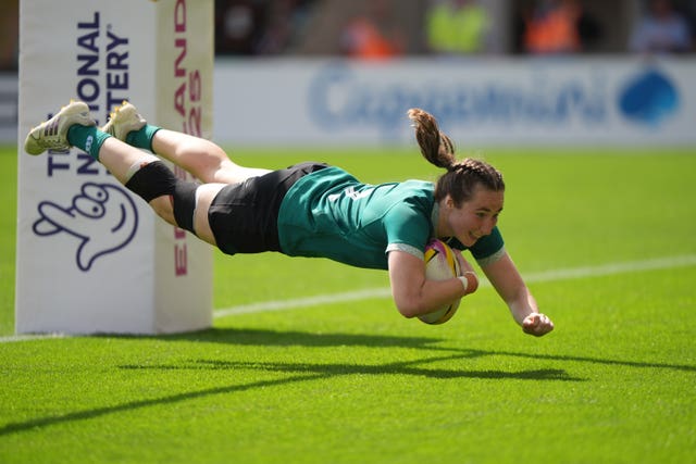 Eve Higgins dives over