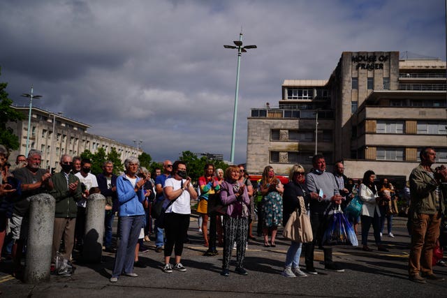 A large crowd gathered in Plymouth city centre to pay their respects to the victims of the Keyham shootings (Ben Birchall/PA)