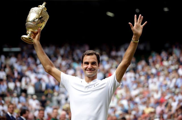 Federer celebrates after winning a record eighth Wimbledon title with victory against Marin Cilic 