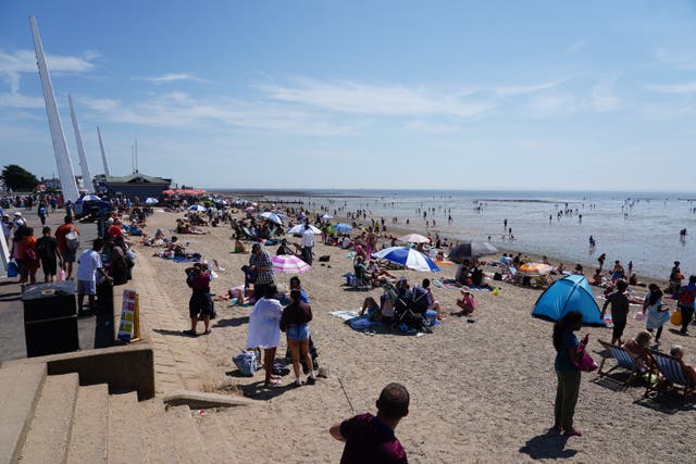 People enjoy the warm weather at Southend-on-Sea as the heatwave continues in the UK