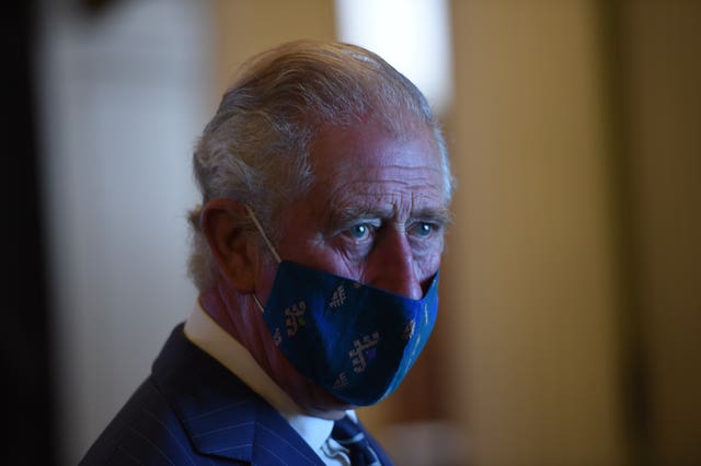 The Prince of Wales wore a mask throughout his visit to the Bank of England. Eddie Mulholland/The Daily Telegraph