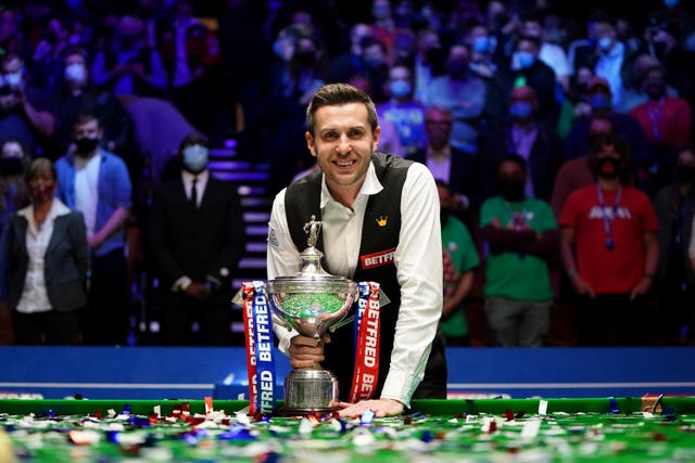 Mark Selby posses for photos after winning the Betfred World Snooker Championship