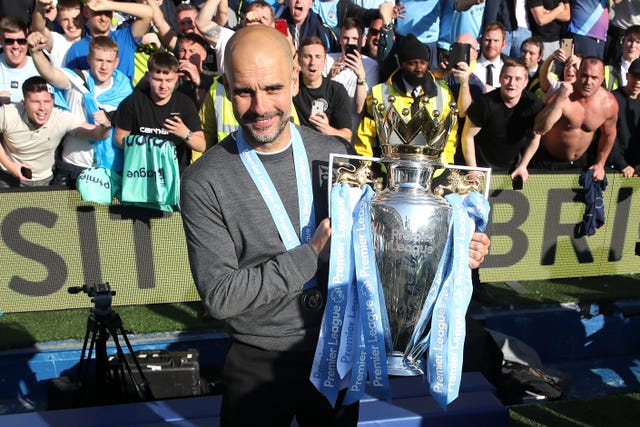 Pep Guardiola celebrates last season's title success