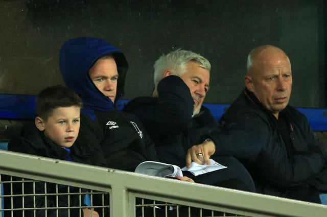 Paul Stretford sits alongside Wayne Rooney at Goodison Park