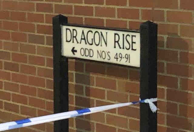 Police tape around the street sign for Dragon Rise in Norton Fitzwarren