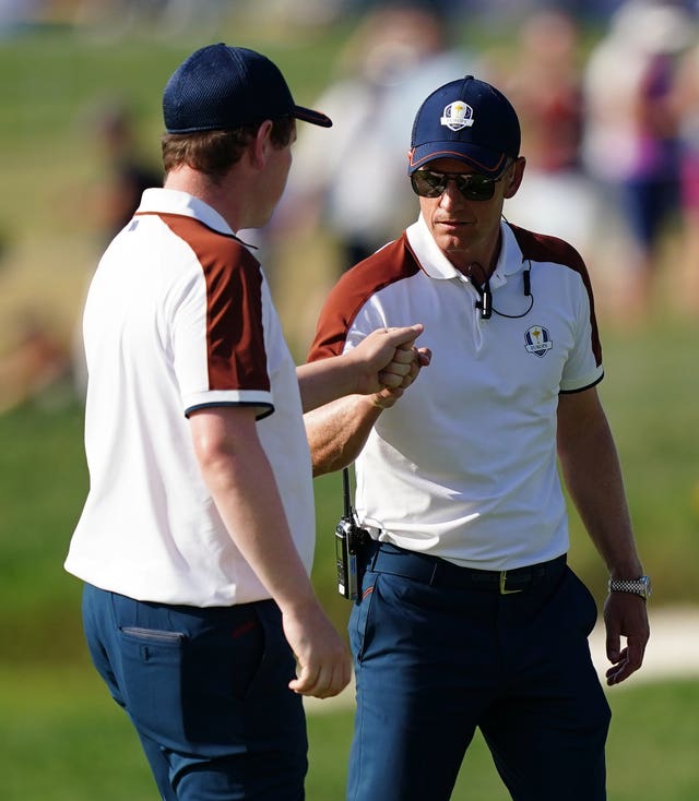 Robert MacIntyre and Luke Donald exchange a fist bump