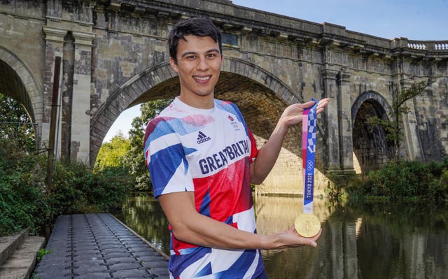 JOe Choong celebrates with his Olympic gold medal