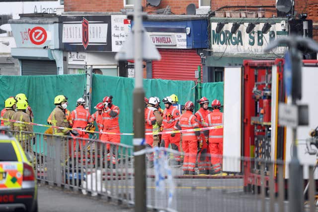 Emergency personnel continue to work at the scene on Hinckley Road in Leicester (Joe Giddens/PA)