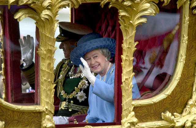 The Queen riding in the Gold State Coach from Buckingham Palace to St Paul’s Cathedral in 2002 