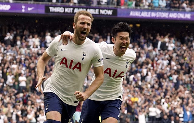 Harry Kane (left) celebrates his penalty against Burnley with strike partner Son Heung-minue – Tottenham Hotspur Stadium