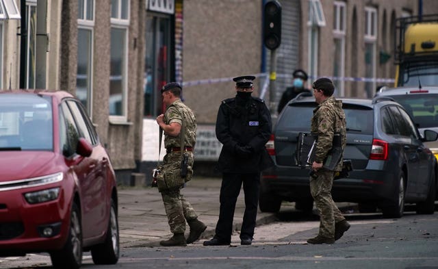 Army Bomb Disposal team make their way to Sutcliffe Street in Liverpool (Peter Byrne/PA)