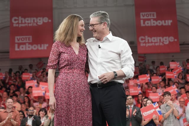 Sir Keir Starmer and his wife stand next to each other