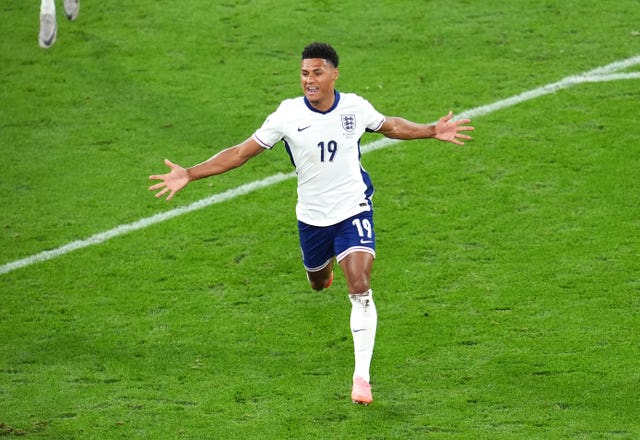 Ollie Watkins stretches his arms out in celebration after scoring the winner against the Netherlands (Adam Davy/PA)