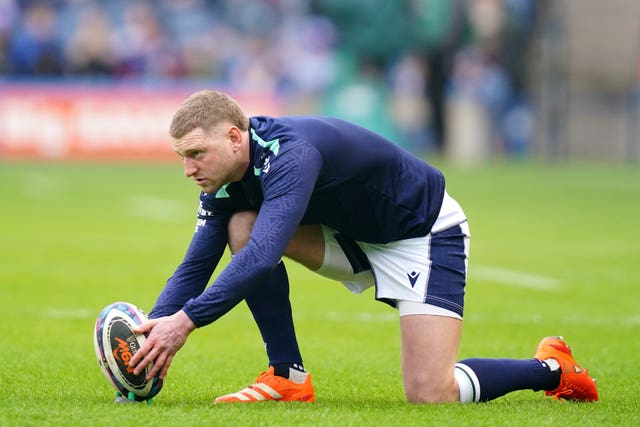 Finn Russell lines up a practice kick at goal