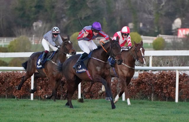 Fascile Mode and jockey Charlie Mullins (centre) coming home to win the Plusvital INH Flat Race during day four of the Leopardstown Christmas Festival at Leopardstown Racecourse