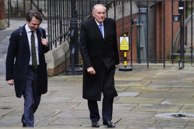 Paul Dacre, right, arrives at the Royal Courts Of Justice, central London 