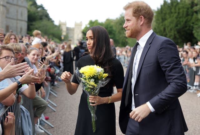 Harry and Meghan met members of the public as they viewed the floral tributes at Windsor Castle on Saturday