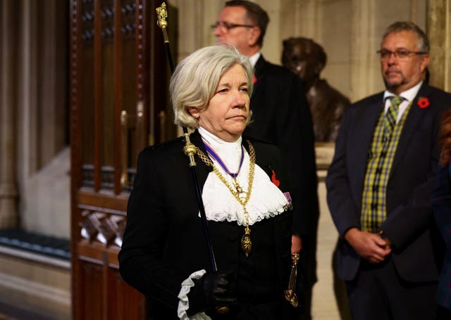 Black Rod Sarah Clarke approaches the House of Commons chamber