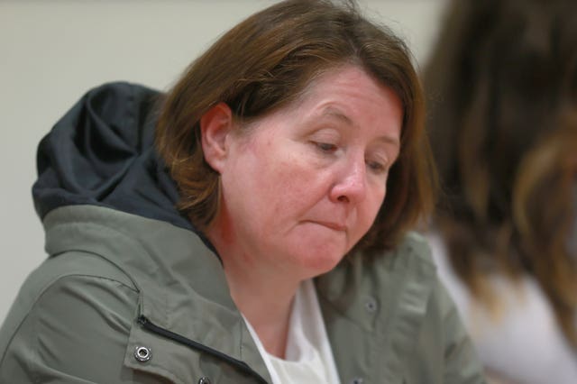 Noleen Mullan, mother of Katie Simpson, sits before the start of a press conference at KRW Solicitors in Belfast