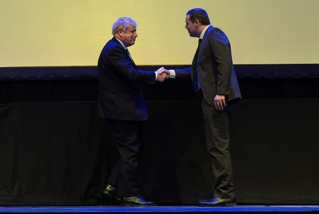 Boris Johnson and Douglas Ross shaking hands