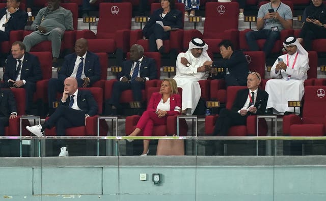 Germany's Interior Minister Interior Minister Nancy Faeser, centre, is wearing the OneLove armband sat next to FIFA president Gianni Infantino, left