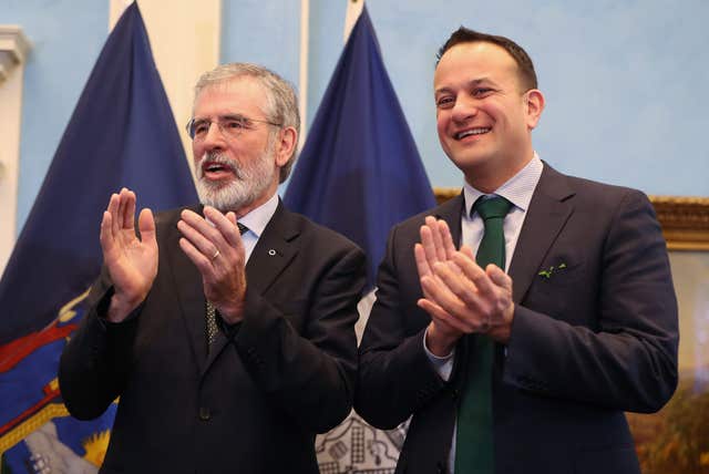 Gerry Adams appears alongside Taoiseach Leo Varadkar (Niall Carson/PA)