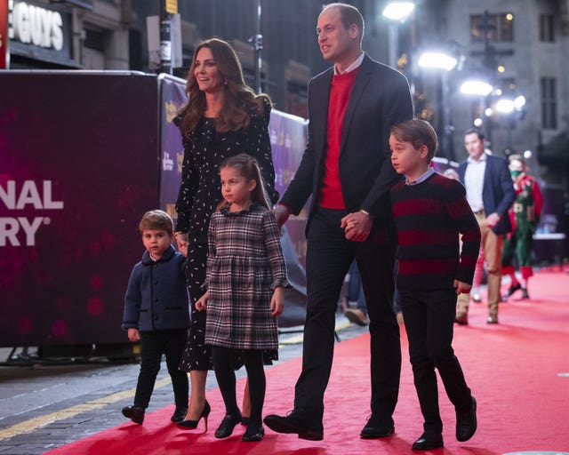 The Duke and Duchess of Cambridge and their children, Prince Louis, Princess Charlotte and Prince George attend a special pantomime performance at London’s Palladium Theatre to thank key workers and their families. Aaron Chown/PA Wire