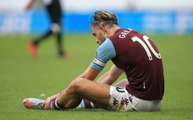 Aston Villa's Jack Grealish sits dejected after the match
