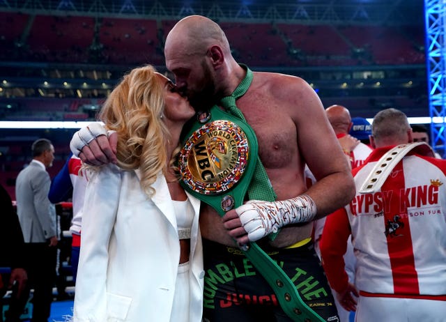 Tyson Fury kisses wife Paris in the boxing ring