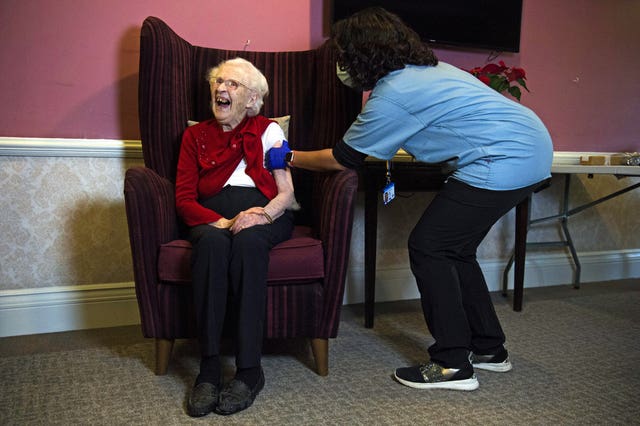 Ellen Prosser, 100, receives the Oxford/AstraZeneca COVID-19 vaccine from Dr Nikki Kanani (Kirsty O’Connor/PA)